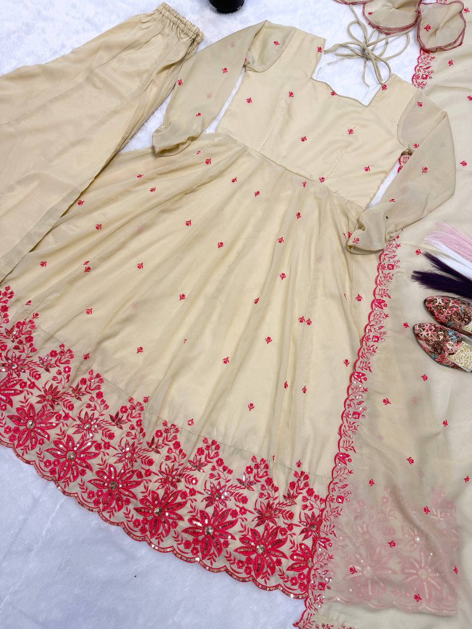 Exquisite Beige Flared Anarkali Suit Set Adorned with Vibrant Red Floral Embroidery, Sequined Scalloped Hem, and an Elegant Tie-Up Back